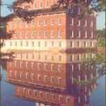 recent photo of the mill reflecting in the water