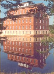 recent photo of the mill reflecting in the water