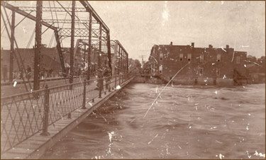 old bridge over the damn by the mill