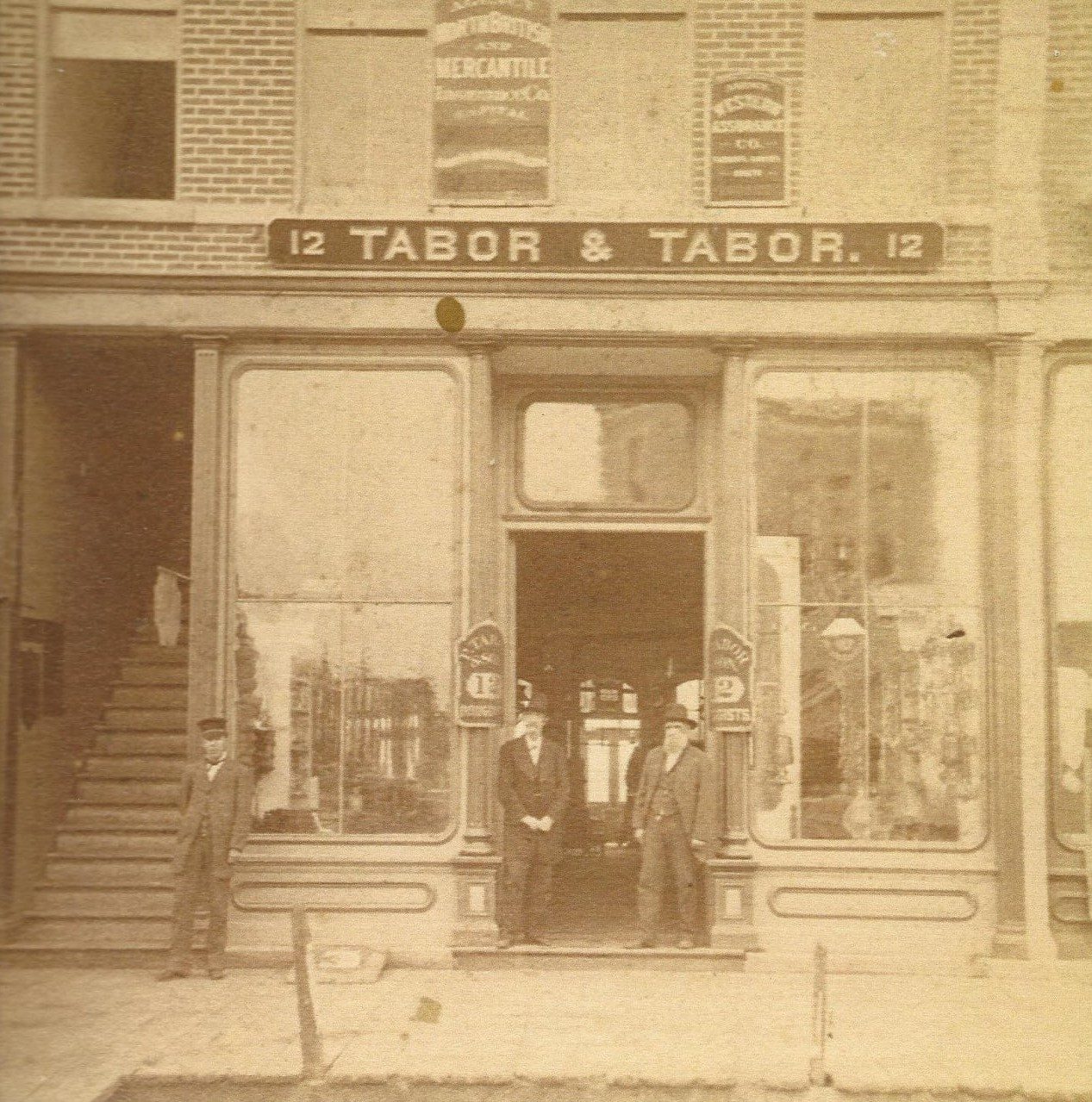 Tabor & Tabor (12 Main St.) - B.W. (Byron W.) Tabor druggist & stationer. Now 115 1st St. E (Ohl Realty). Byron Tabor was also the time-keeper for all the races at the kite track.
