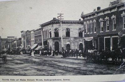 Circa 1914. Known as 'bank corner'. Building in the middle is Farmers State Savings Bank (now Bank Iowa). To the right (now Majestic corner) was known as 